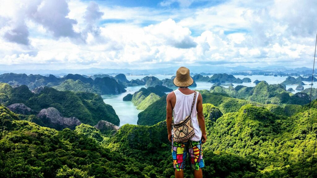 pexels-photo-2847871-2847871 A man enjoys the breathtaking view of Ha Long Bay's lush islands and serene waters.